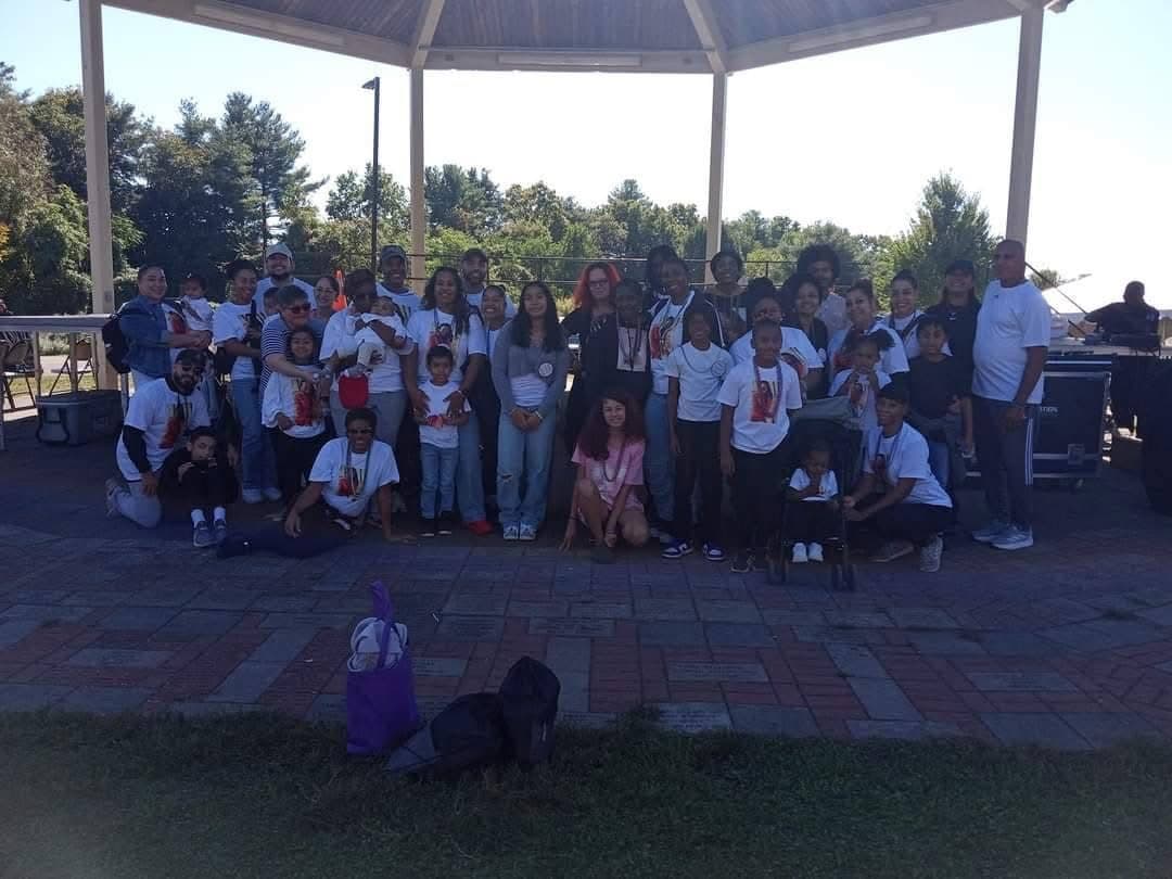 A large group gathered outdoors at a community event