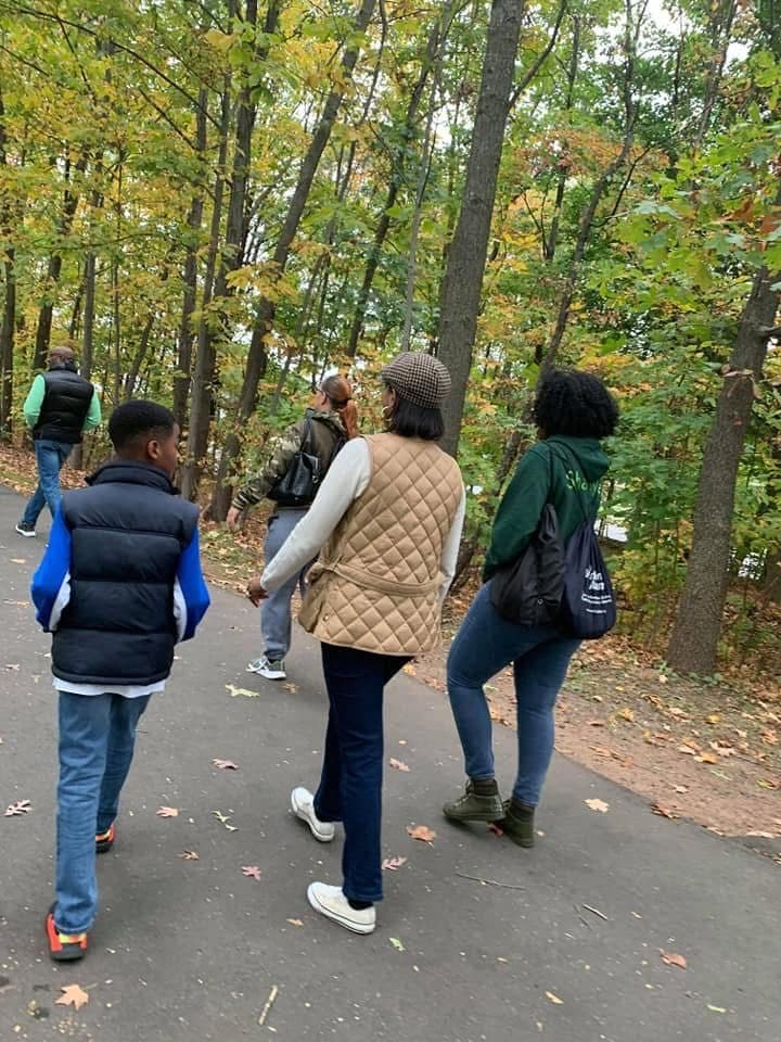 Walkers on a wooded trail